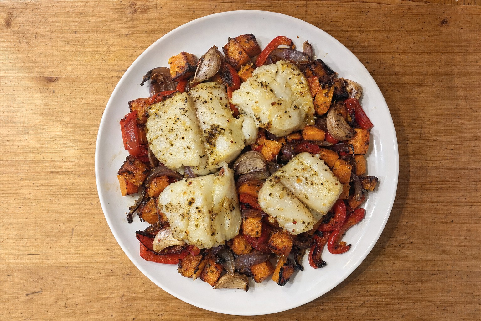 Bacalhau assado com batata-doce e pimento
